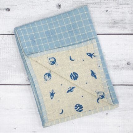 Zero twist dual layer 100 percent pure cotton bath towel neatly folded on a soft lifestyle background, showcasing plush texture and thickness