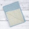 Zero twist dual layer 100 percent pure cotton bath towel neatly folded on a soft lifestyle background, showcasing plush texture and thickness