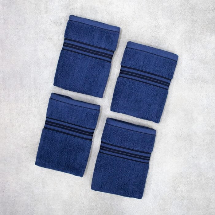 Pack of four 100% pure cotton terry hand towels with soft texture and high absorbency, suitable for bathroom and daily use.