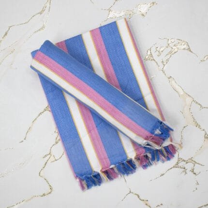 Soft cotton bath towels neatly folded, made from 100% pure cotton with high absorbency and quick-dry fabric for everyday bathroom use.